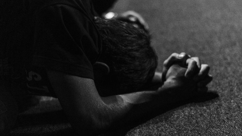Kneeling in prayer